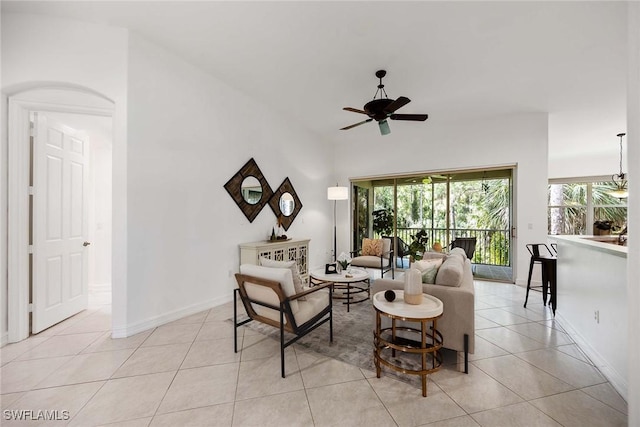 tiled living room with ceiling fan