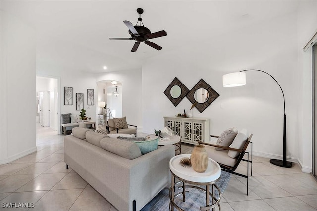 tiled living room with ceiling fan