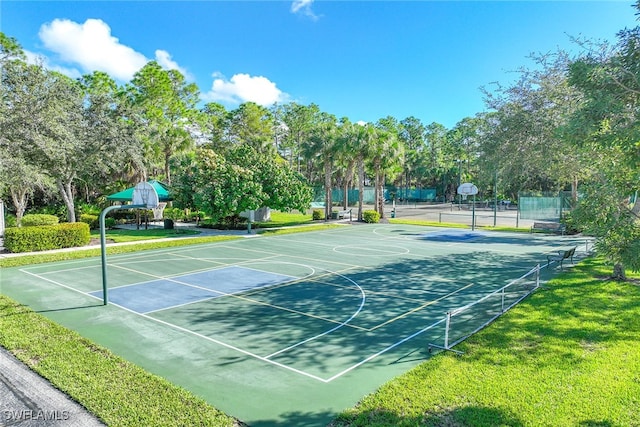 view of sport court with a yard and tennis court