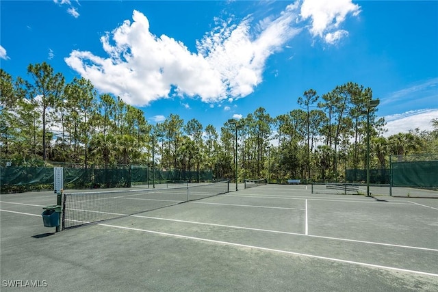 1732 Tarpon Bay Dr S Unit 203, Naples, FL 34119 - view of tennis court with fence