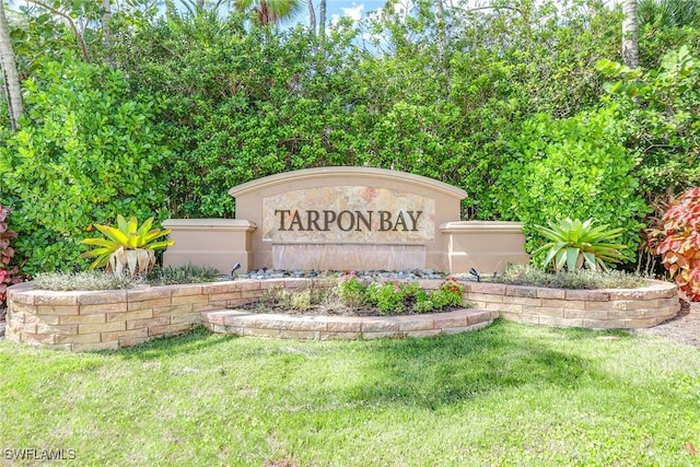 1732 Tarpon Bay Dr S Unit 203, Naples, FL 34119 - community sign featuring a yard