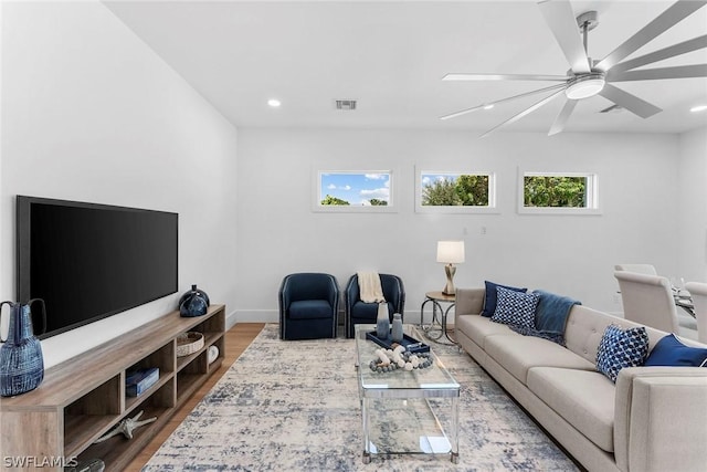 living room with ceiling fan and hardwood / wood-style floors