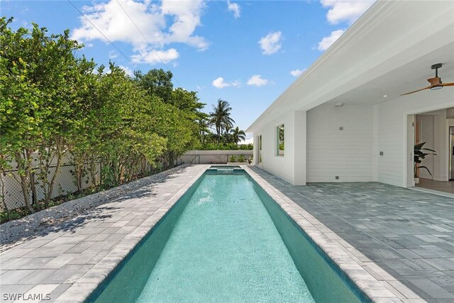 view of pool with ceiling fan