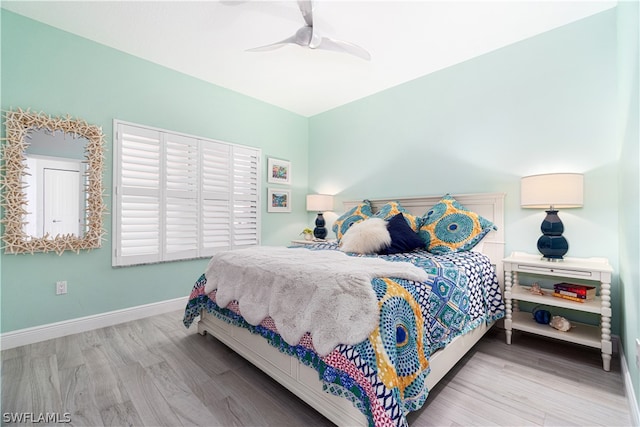 bedroom featuring light wood-type flooring and ceiling fan