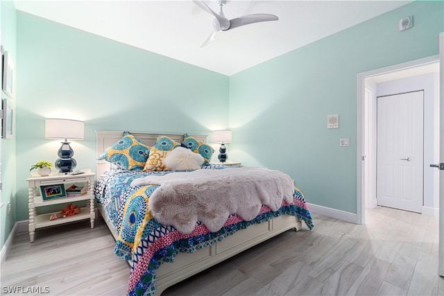 bedroom featuring light hardwood / wood-style floors and ceiling fan