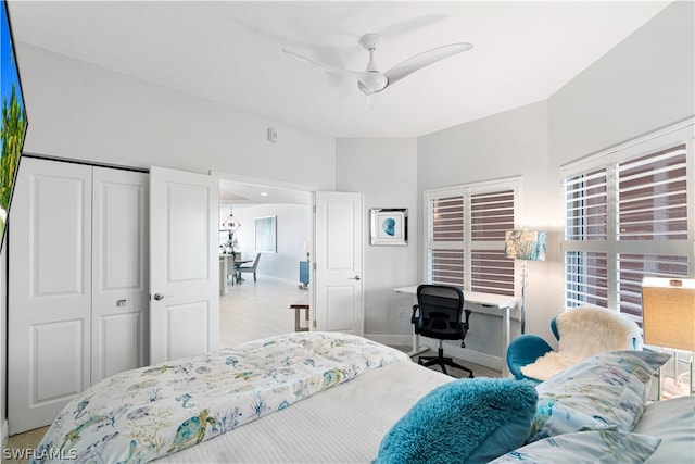 bedroom with a closet, wood-type flooring, and ceiling fan