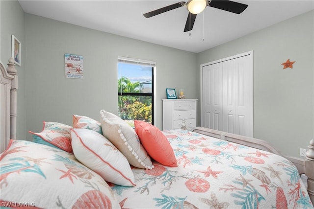 bedroom featuring ceiling fan and a closet