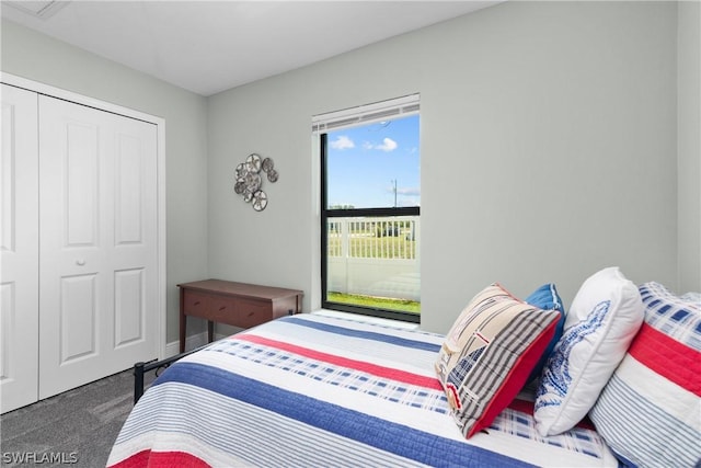 carpeted bedroom with a closet