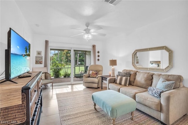 tiled living room featuring ceiling fan