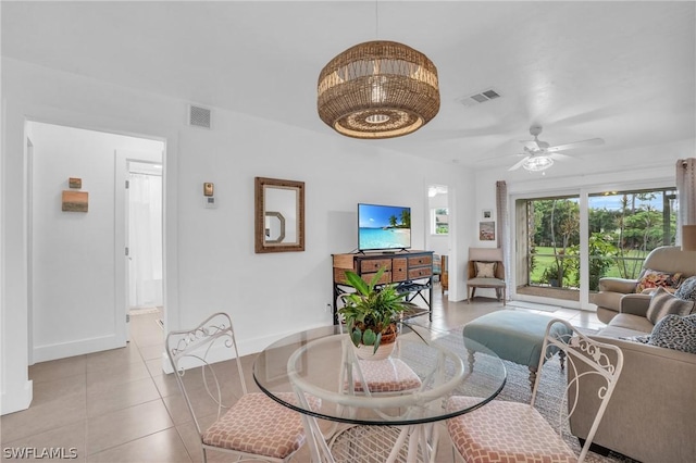 dining room with ceiling fan and light tile patterned floors