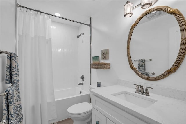 full bathroom with shower / bath combination with curtain, vanity, and toilet