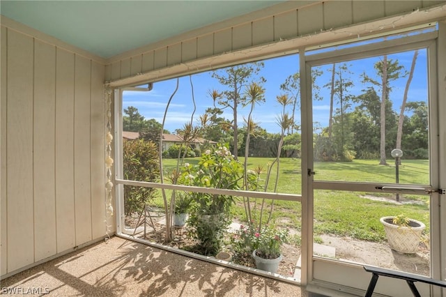 unfurnished sunroom featuring a wealth of natural light