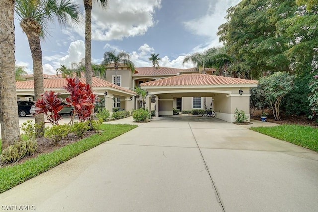 mediterranean / spanish house with a carport