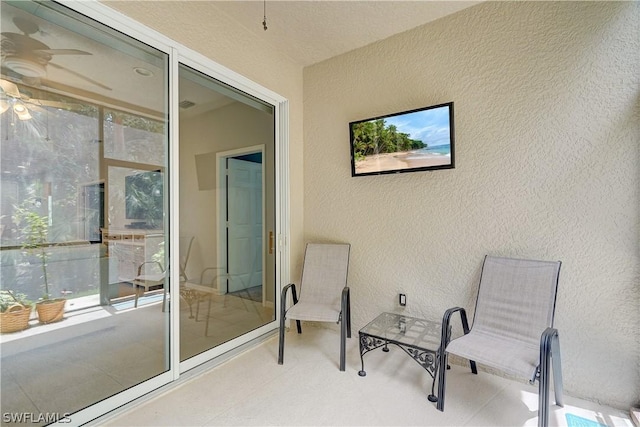 view of patio featuring a balcony