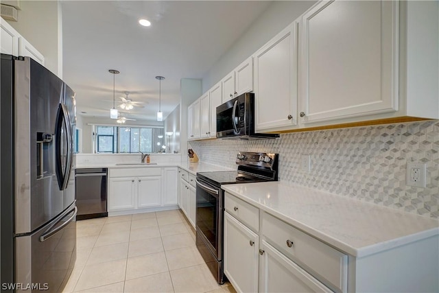 kitchen featuring stainless steel appliances, sink, and white cabinets