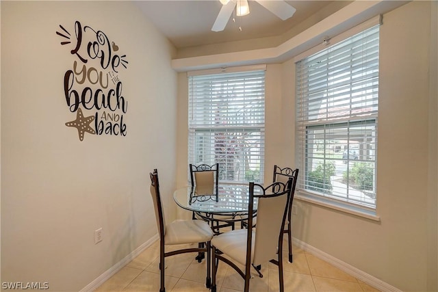 dining space featuring ceiling fan and light tile patterned flooring