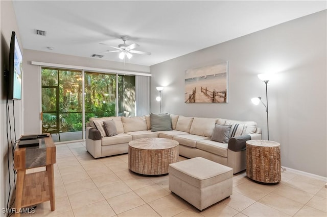 tiled living room with ceiling fan