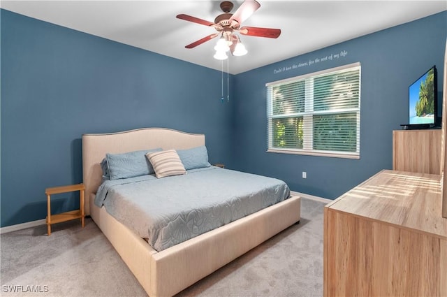 carpeted bedroom with ceiling fan