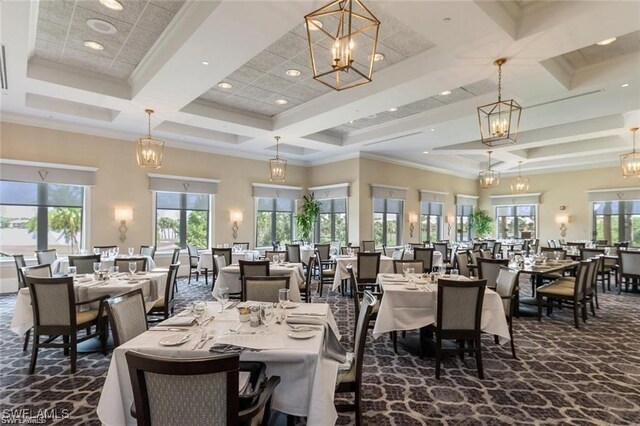 dining area featuring a high ceiling, crown molding, and coffered ceiling