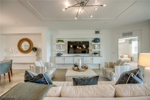 living room with crown molding and a chandelier