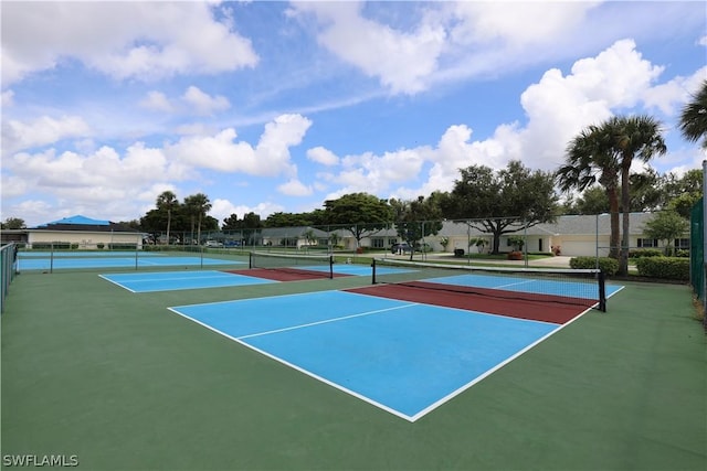 view of tennis court featuring basketball hoop