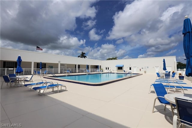 view of swimming pool featuring a patio area