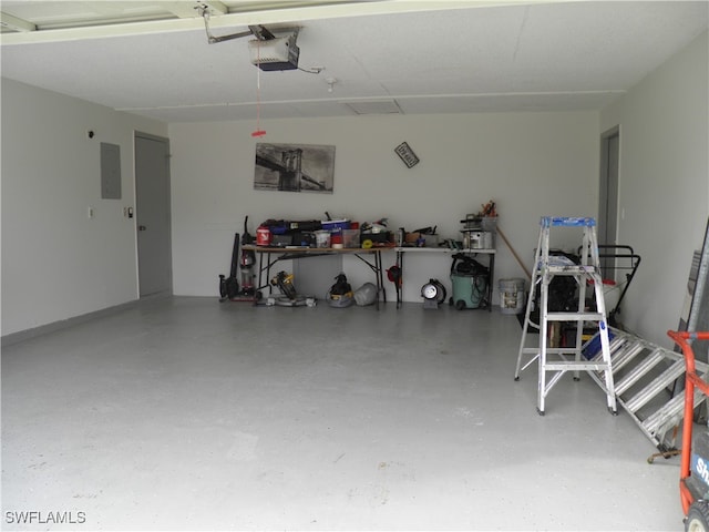 garage featuring a garage door opener and electric panel