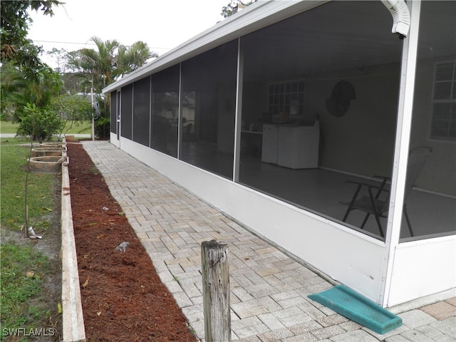 view of patio / terrace featuring a sunroom