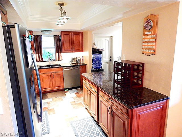 kitchen featuring a raised ceiling, hanging light fixtures, appliances with stainless steel finishes, light tile patterned floors, and sink