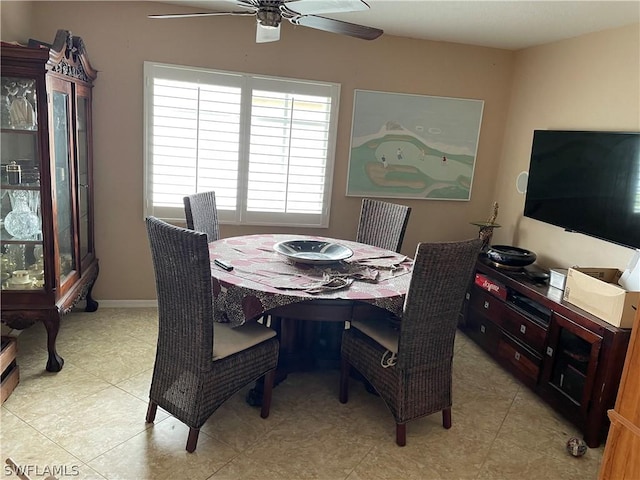 tiled dining room with ceiling fan