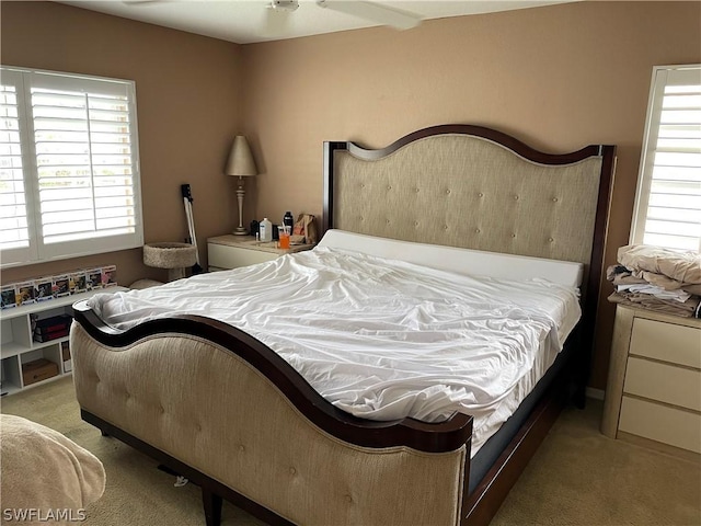 bedroom featuring light colored carpet