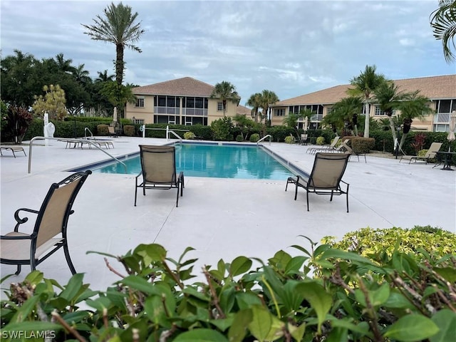 view of pool featuring a patio area