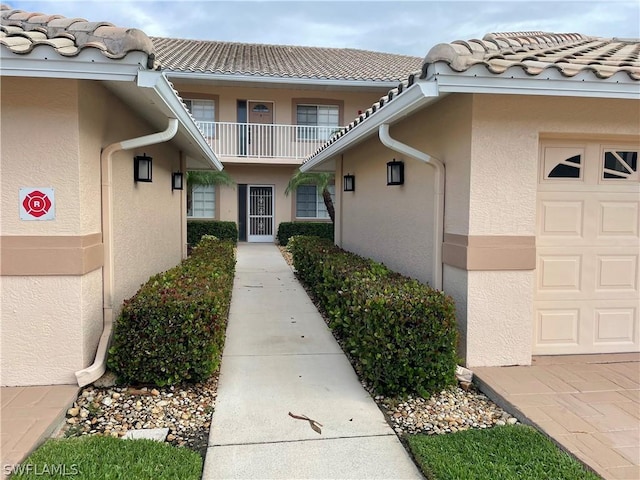 view of exterior entry featuring a garage