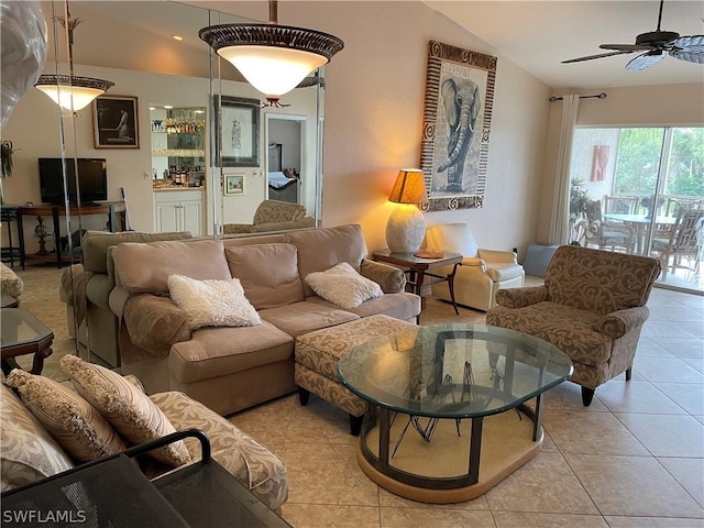 living room with vaulted ceiling, light tile patterned flooring, and ceiling fan