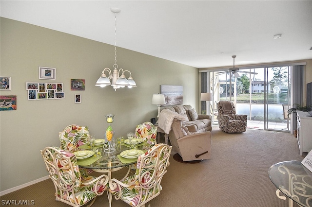 14931 Park Lake Dr Unit 109, Fort Myers, FL 33919 - carpeted dining area with a chandelier, a ceiling fan, and floor to ceiling windows
