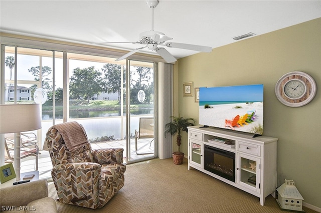 14931 Park Lake Dr Unit 109, Fort Myers, FL 33919 - living area with ceiling fan and carpet flooring