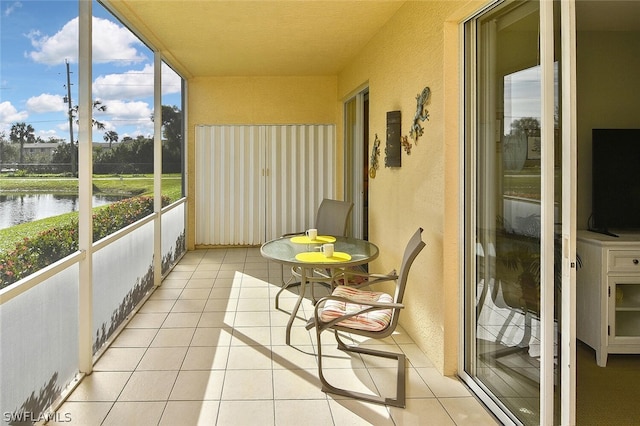 14931 Park Lake Dr Unit 109, Fort Myers, FL 33919 - sunroom featuring a water view