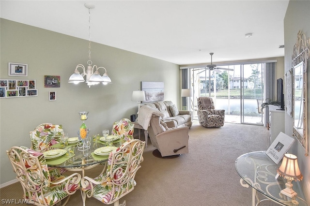 14931 Park Lake Dr Unit 109, Fort Myers, FL 33919 - carpeted dining area featuring a chandelier and a ceiling fan