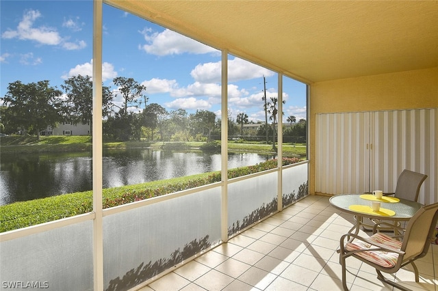 14931 Park Lake Dr Unit 109, Fort Myers, FL 33919 - sunroom / solarium with a water view