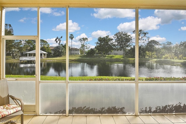 14931 Park Lake Dr Unit 109, Fort Myers, FL 33919 - unfurnished sunroom featuring a water view