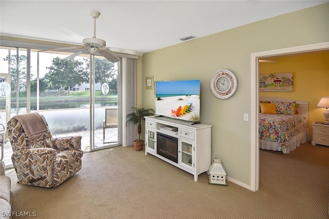 14931 Park Lake Dr Unit 109, Fort Myers, FL 33919 - living area with carpet flooring and ceiling fan