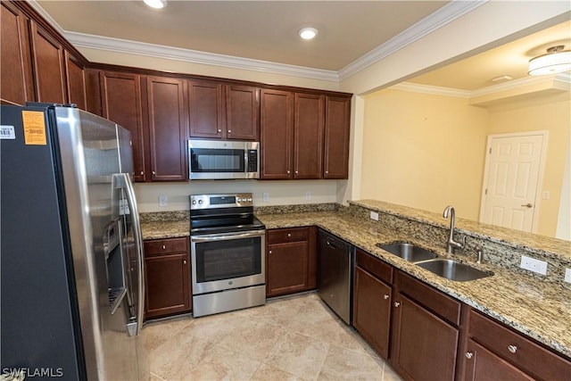 kitchen with kitchen peninsula, appliances with stainless steel finishes, light stone counters, crown molding, and sink