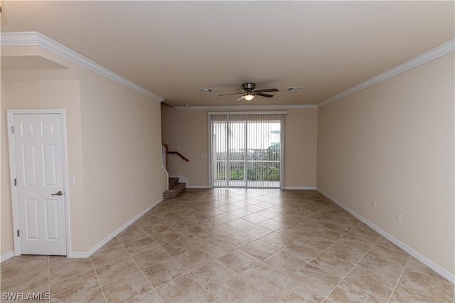 empty room featuring ceiling fan and ornamental molding