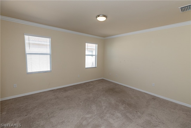 carpeted empty room featuring ornamental molding