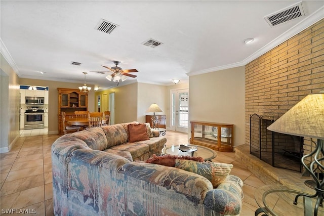 tiled living room with a brick fireplace, ceiling fan, and crown molding