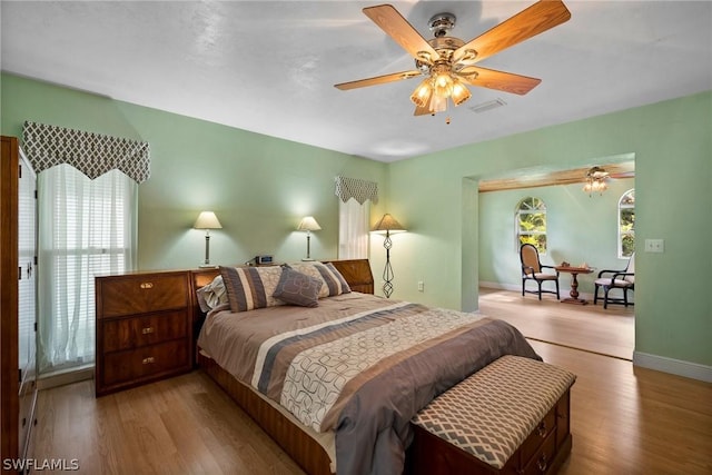 bedroom featuring wood-type flooring and ceiling fan