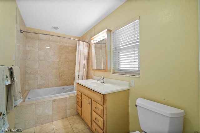 full bathroom with toilet, tile patterned floors, shower / tub combo with curtain, and vanity