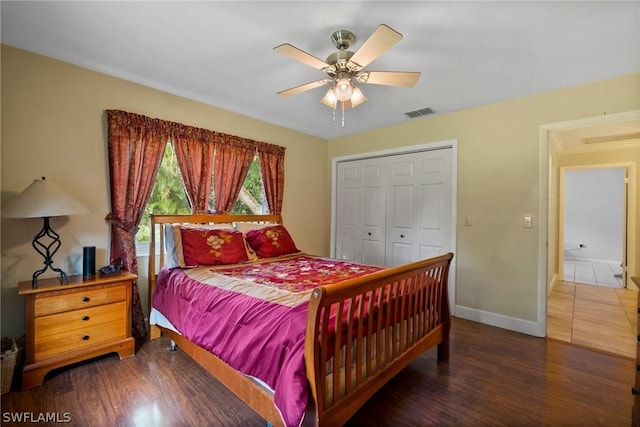 bedroom featuring a closet, ceiling fan, and dark hardwood / wood-style floors