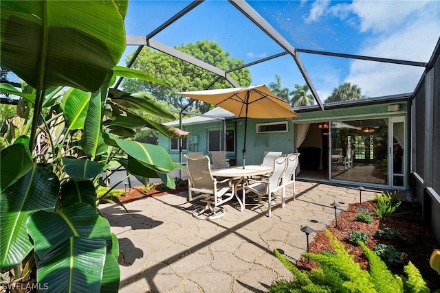 view of patio / terrace featuring glass enclosure