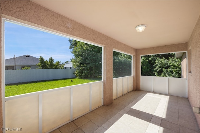 unfurnished sunroom featuring plenty of natural light